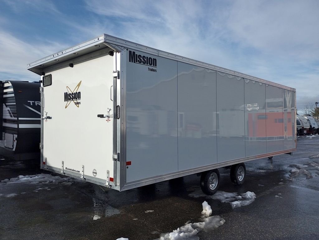 2024 Mission Trailers 24 ft Deckover – Galvanized Package – Rear three-quarter view showing the long white side and rear ramp door