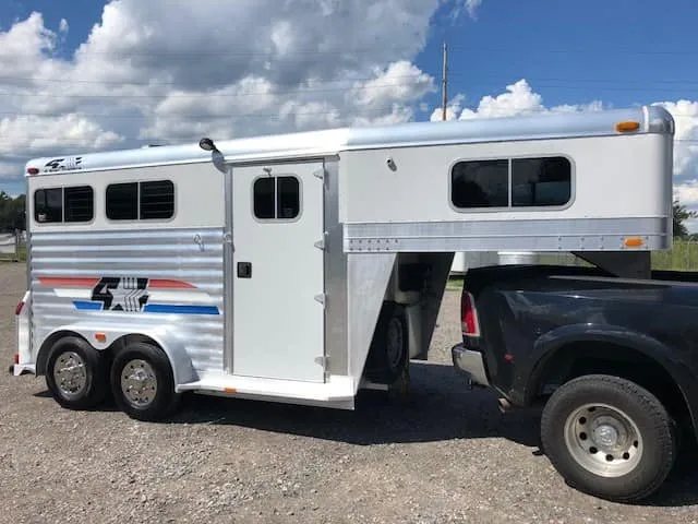 2004 4 Star 2 Horse Gooseneck Trailer – Slant Load, White – Full profile view of the driver side showing the side entry door
