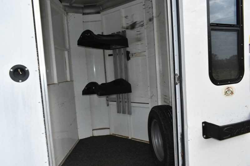 2005 Sundowner 2 Horse Trailer – Sunlite Straight Load – Interior view of the front dressing room with saddle racks and spare