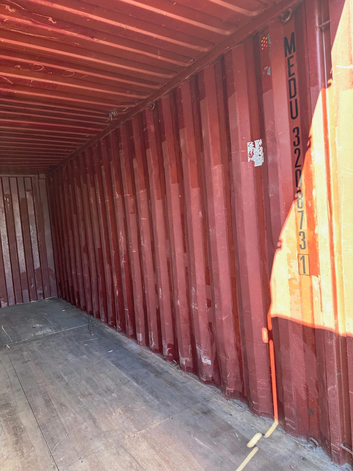 20ft Used Shipping Container – Yellow/Gold, Double Cargo Doors – empty container interior with red walls and worn wooden floor (11)