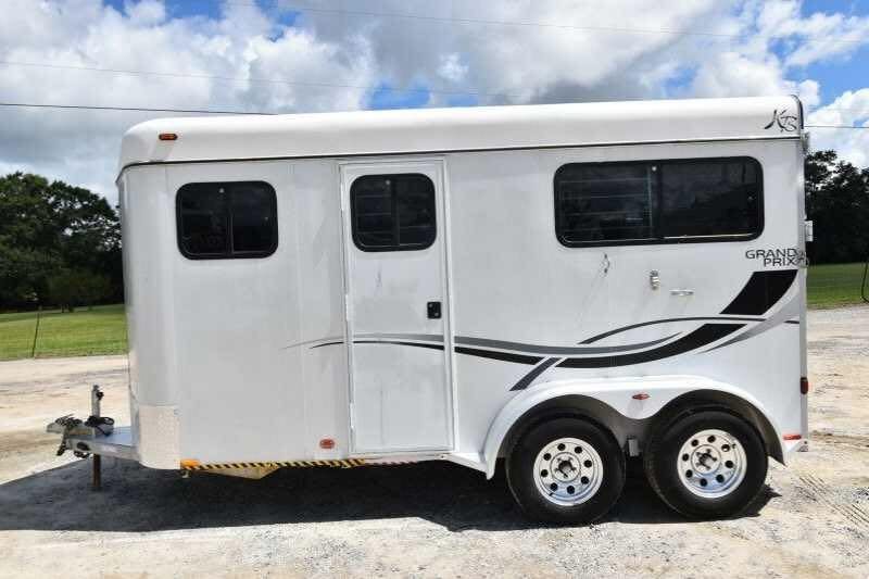2002 Kiefer Built 2 Horse Bumper Pull – Dressing Room – Profile view of white two horse bumper pull trailer on a gravel lot