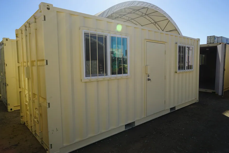 20ft Ground-Level Office Container – Insulated Workspace – three-quarter office container exterior with barred windows and entry door