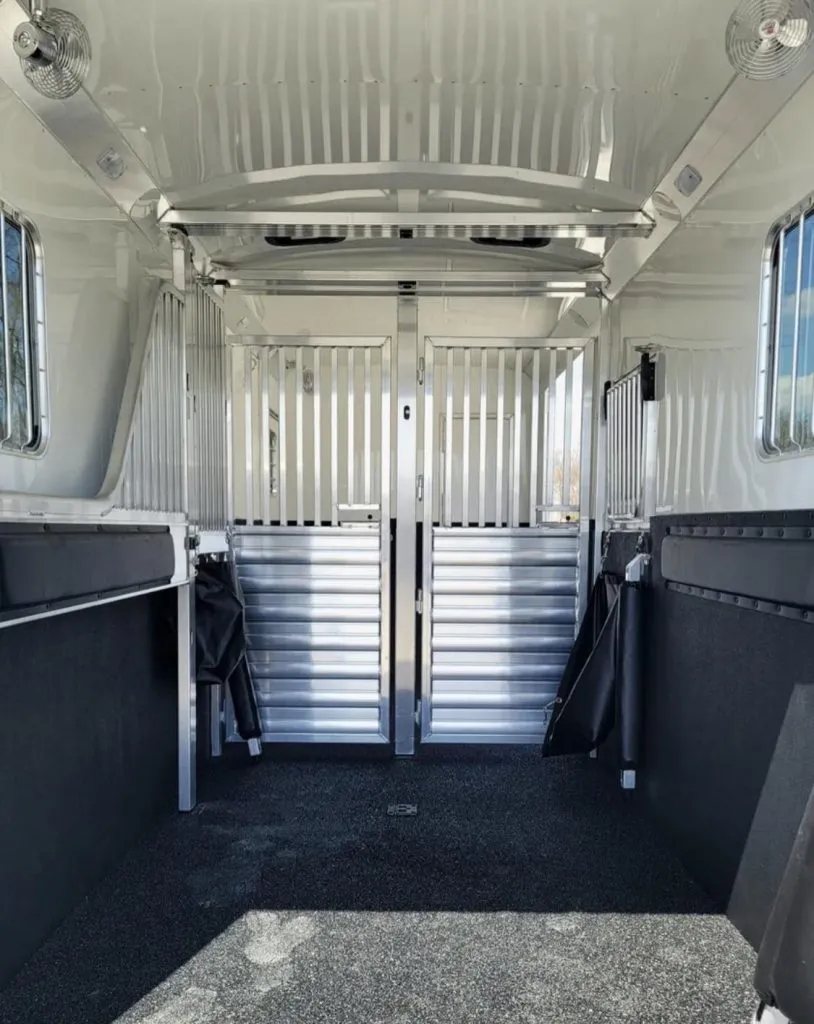 2023 4 Star 23 ft Horse Trailer – 2+1 Gooseneck – Clean interior shot showing two stalls and stall fans installed