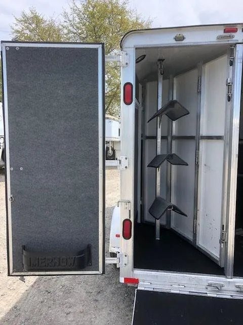2010 Merhow 3 Horse Bumper Pull Trailer – Rear Ramp – Open rear tack compartment door with gray felt lining and storage tray