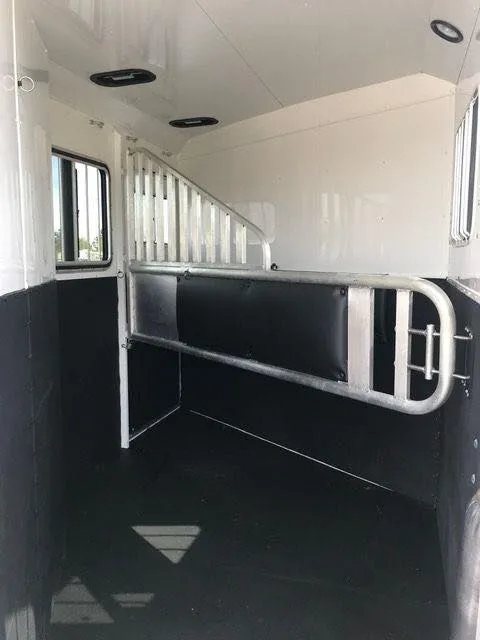 2010 Merhow 2 Horse Slant Trailer – Insulated Roof, Escape Door – Interior shot focusing on the horse stall divider and roof vents