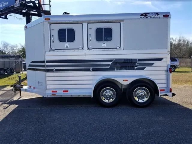2001 4 Star 2 Horse Bumper Pull Trailer – Slant Load – Flat side profile of the street side showing dual axles and windows