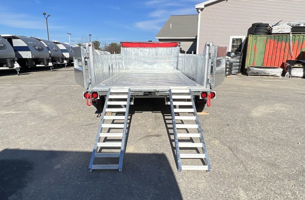 2024 N&N Trailers 14 ft Dump – Galvanized Steel – Rear view of the dump trailer with loading ramps extended to the ground