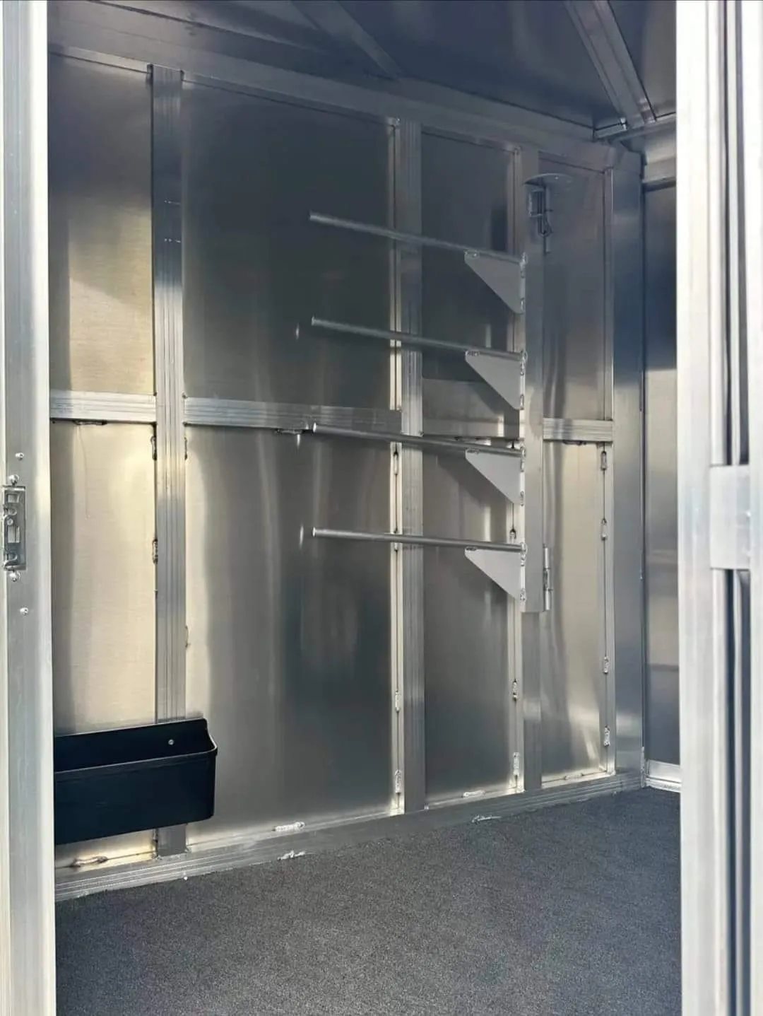 2012 Featherlite 9400 2 Horse Trailer – Removable Tack – Interior of the tack room showing saddle racks and storage space