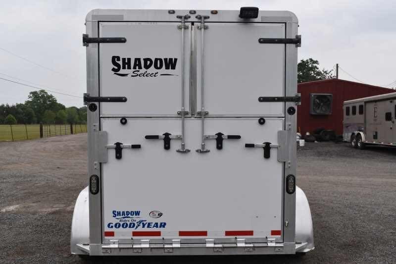 2013 Shadow 2HSL 2 Horse Trailer – Aluminum, Dressing Room – Rear view of the trailer showing closed white double doors and manufacturer decals