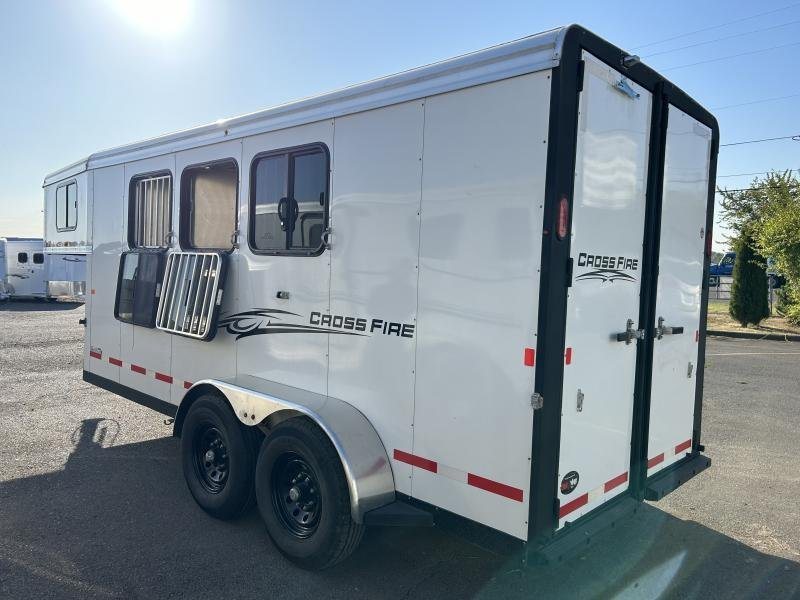 2022 Logan Coach Crossfire 3 Horse Trailer – Swing-Out Saddle Rack – Rear three-quarter view from the other side showing windows and wheels