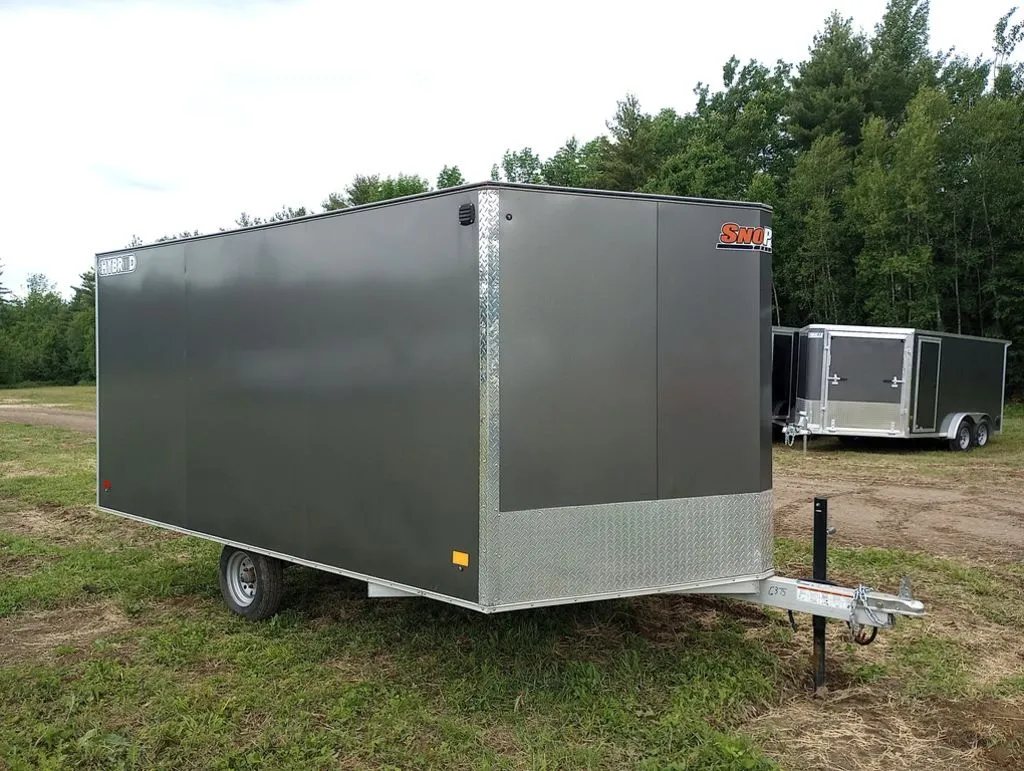2022 Sno Pro Trailers Hybrid 2.0 – Charcoal Snowmobile Trailer – Front three-quarter view of the driver side showing the V-nose and hitch