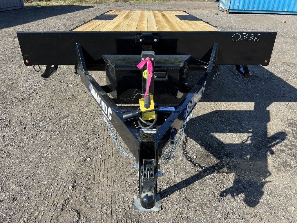 2024 Diamond C 20 ft Deckover – Slide-In Ramps – A close-up view of the trailer tongue, coupler, and front storage box