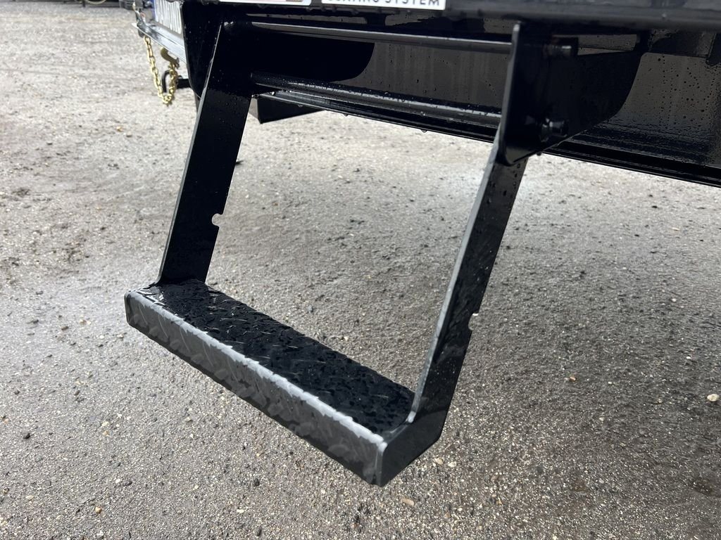 2024 Diamond C 24 ft Deckover – Blackwood Deck – Close up of a fold down metal step with diamond plate texture