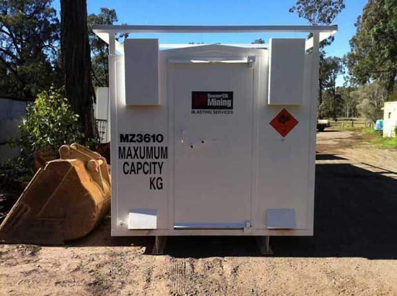 Explosive Storage Magazine – White, Insulated – Straight on view of white storage unit door with hazard signage and capacity text