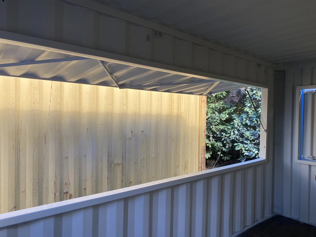 15ft Custom Container Bar & Kiosk – Side Service Hatches – empty container interior with large raised service hatch