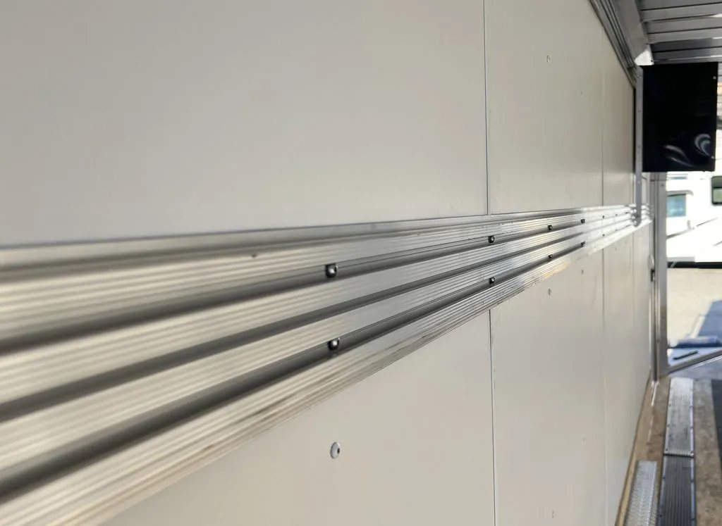 2024 Sno Pro 22 ft Snowmobile Trailer – Extra Height – Aluminum track system mounted horizontally along the white interior wall