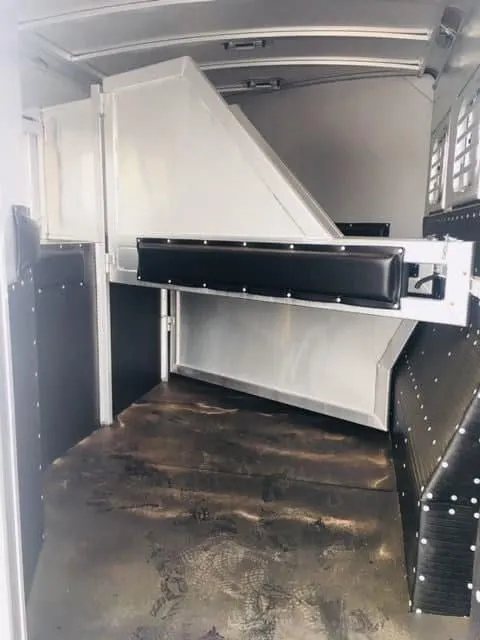 2018 Platinum Coach 3 Horse Bumper Pull – Rear Tack – Interior of the horse stalls with rubber floor mats and padded dividers