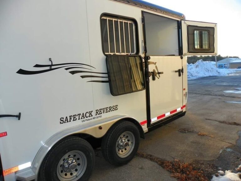 2022 Double D 2 Horse Bumper Pull – Reverse Slant – Partial side view showing wheels and open windows with protective bars