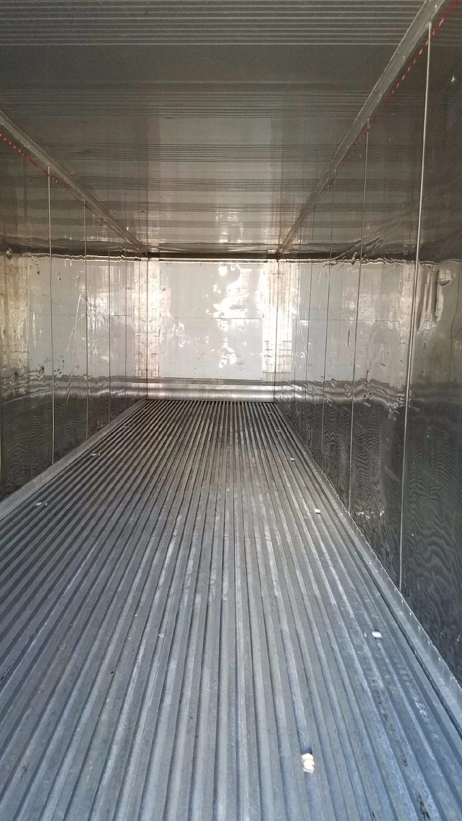 40ft High Cube Reefer Container – Operational Refrigeration – empty refrigerated container interior with metal walls and ribbed floor