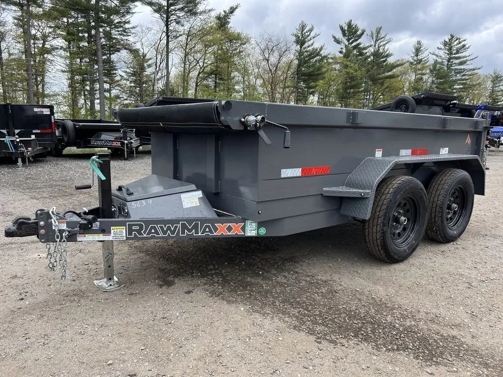 2024 RawMaxx 10 ft Dump Trailer – Shadow Grey – A three-quarter exterior view of a grey powder coated dump trailer with tarp kit