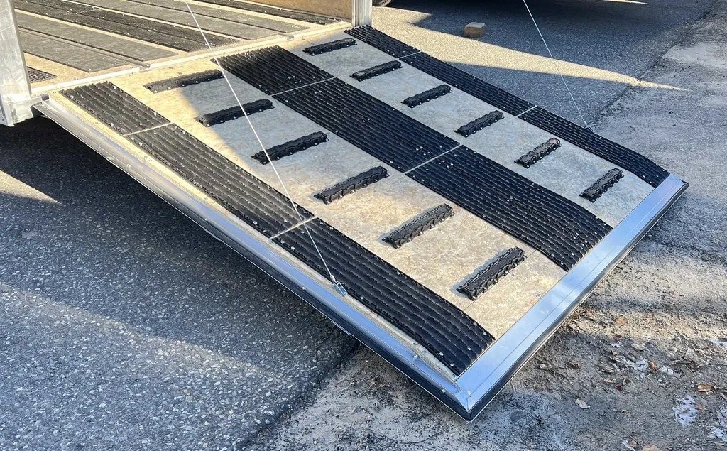 2024 Sno Pro 22 ft Snowmobile Trailer – Extra Height – Low angle view of the rear ramp door with traction strips and support cables