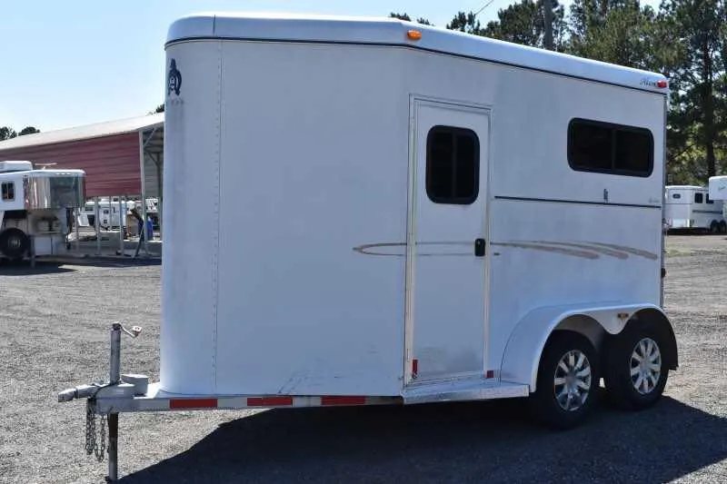 2004 Dalton 2 Horse Bumper Pull Trailer – Aluminum, Straight Load – Three-quarter view of the trailer front and driver side from a low angle