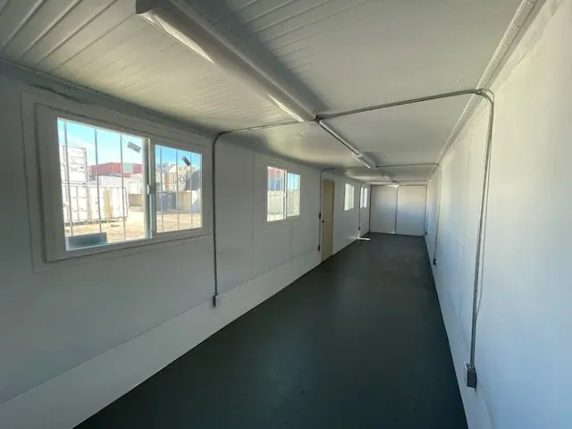 40ft Converted Office Container – Insulated, Four Barred Windows – empty office container interior with windows and ceiling lights