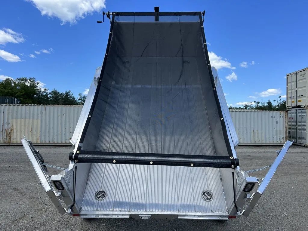 2024 Cargo Pro 12 ft Dump Trailer – Aluminum – View looking into the empty raised dump bed with the black mesh tarp