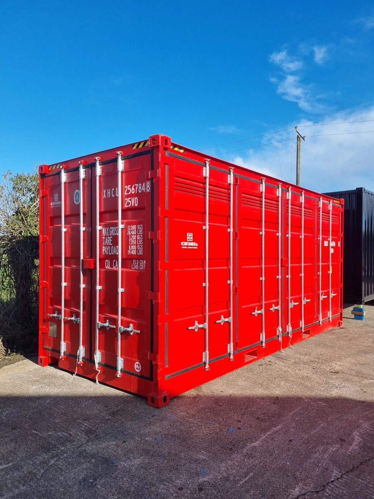 20ft Bunded Hazardous Goods Container – Vented Storage – three-quarter exterior view of red container with closed side doors
