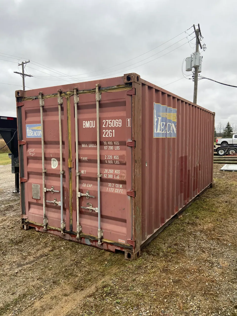 20ft Used Shipping Container – Double Cargo Doors – three-quarter exterior view of weathered container with closed cargo doors (3)