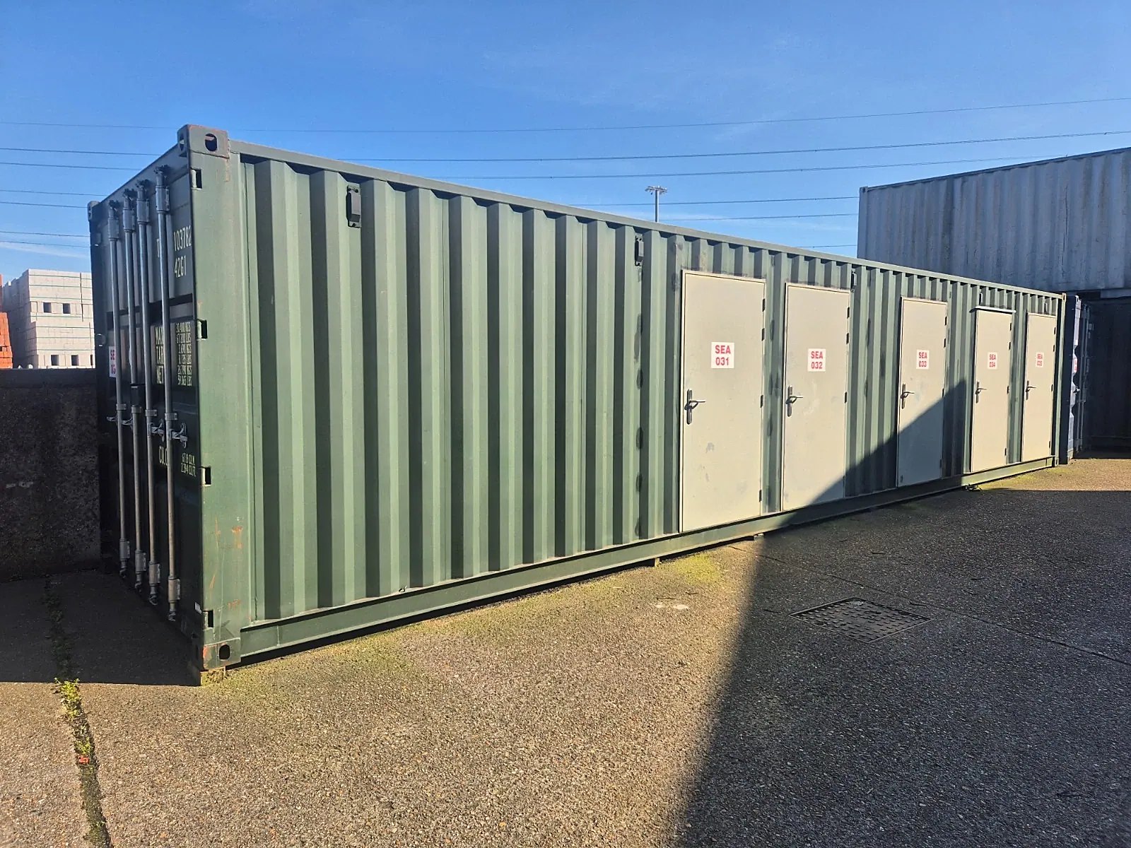 40ft One-Trip Shipping Container – Five Side Doors – Three-quarter exterior of container with five separate storage entry doors