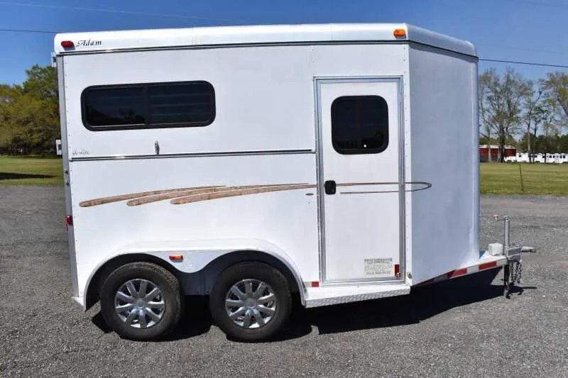 2004 Dalton 2 Horse Bumper Pull Trailer – Aluminum, Straight Load – Clean profile view of the trailer passenger side with entry door and window