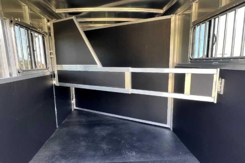 2024 Shadow 2 Horse Bumper Pull Trailer – Aluminum, Dressing Room – Interior horse stall area with the stall divider swung open