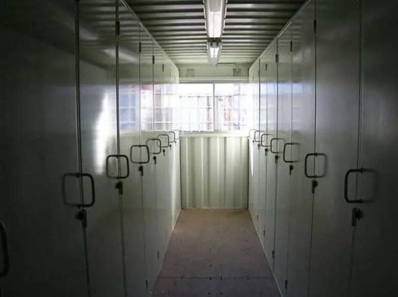 20 ft Container Change Room – Gray – Interior view of the container conversion featuring rows of individual lockers and lighting