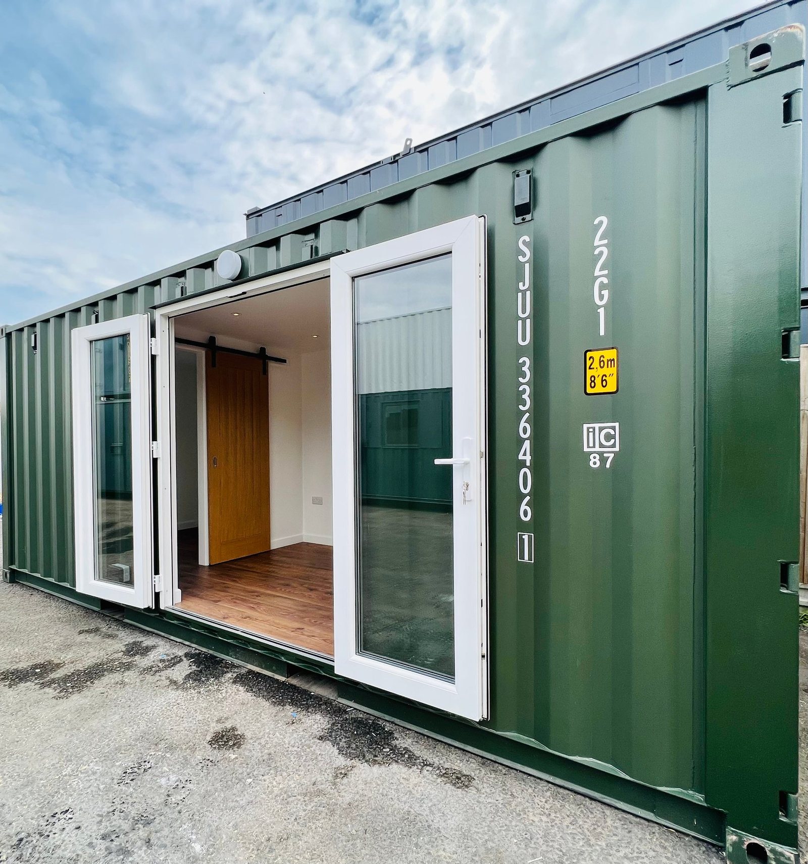 20ft Container Home – One Bed Box, 1 Bedroom – This 20x8 ft refurbished shipping container home features a large glass entry and elegant interior finishes like wood-style flooring