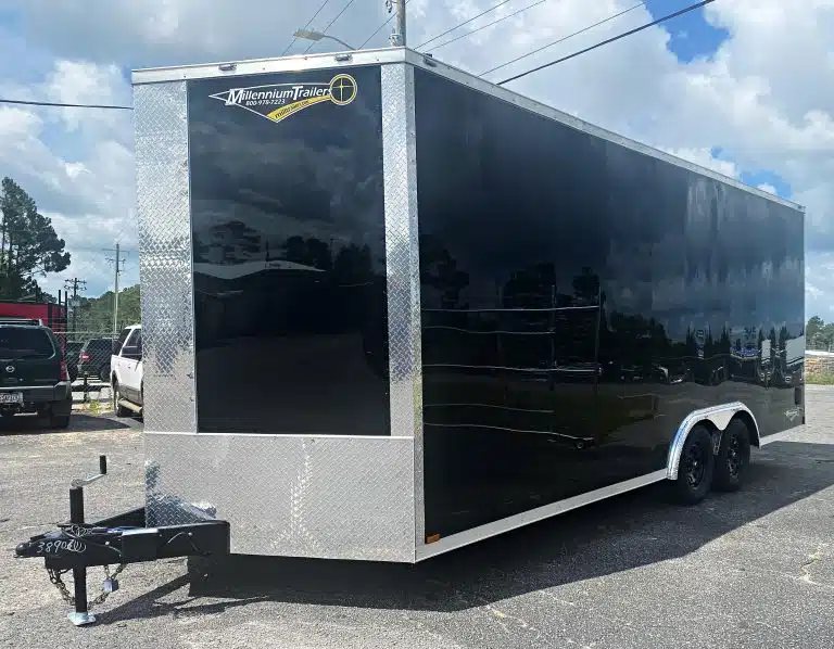 2026 Millennium 20 ft Car Trailer – Extra Height – Three-quarter exterior view of a long black enclosed car trailer parked outdoors