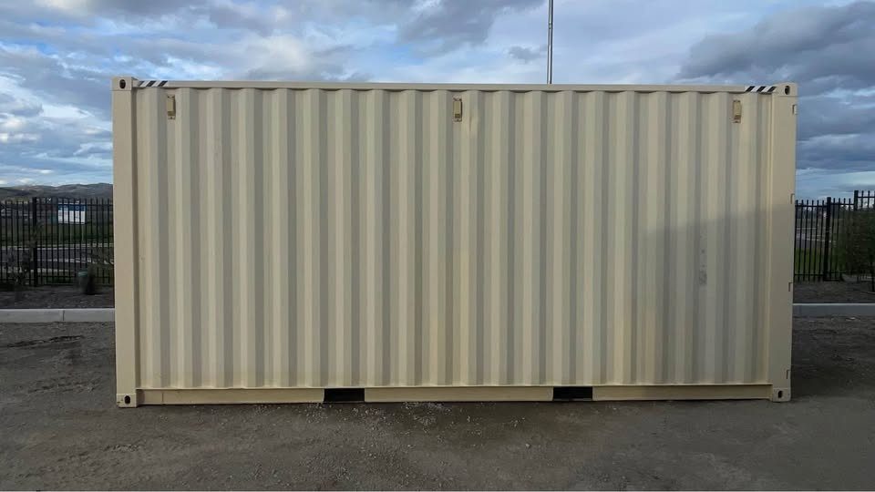 20ft High Cube Shipping Container – Rear Rollup Door – straight-on side view of closed corrugated shipping container