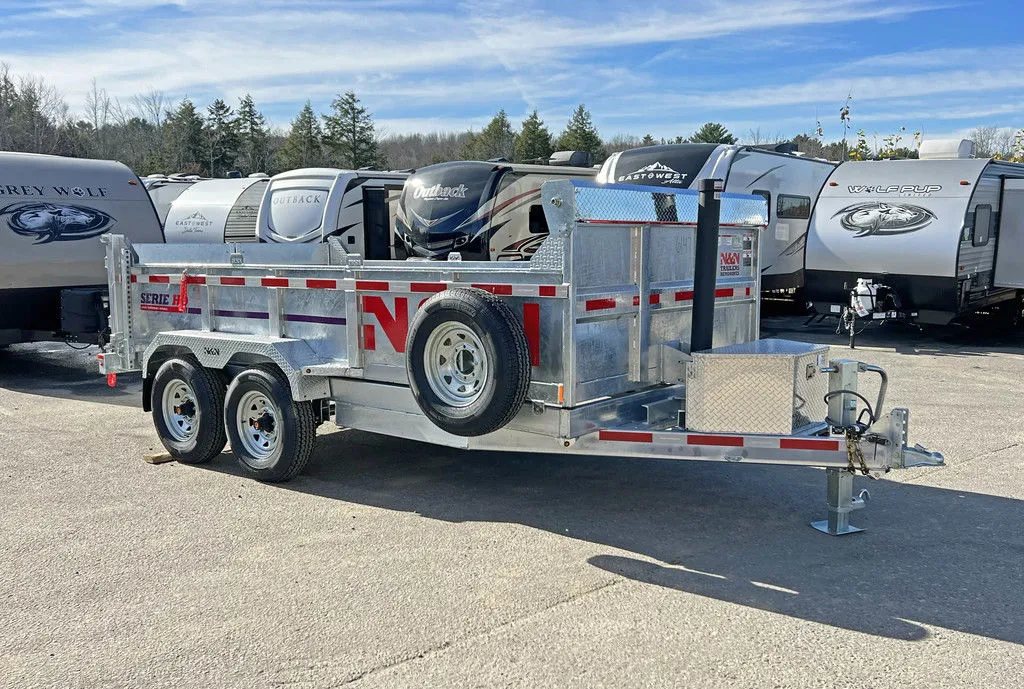 2024 N&N Trailers 14 ft Dump – Galvanized Steel – Full side view profile of the galvanized dump trailer showing the spare tire