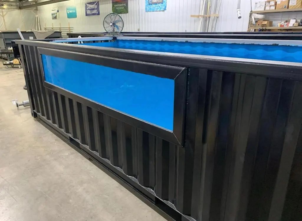 40ft Custom Container Pool – Side Viewing Window – black container pool with blue lining and side viewing window