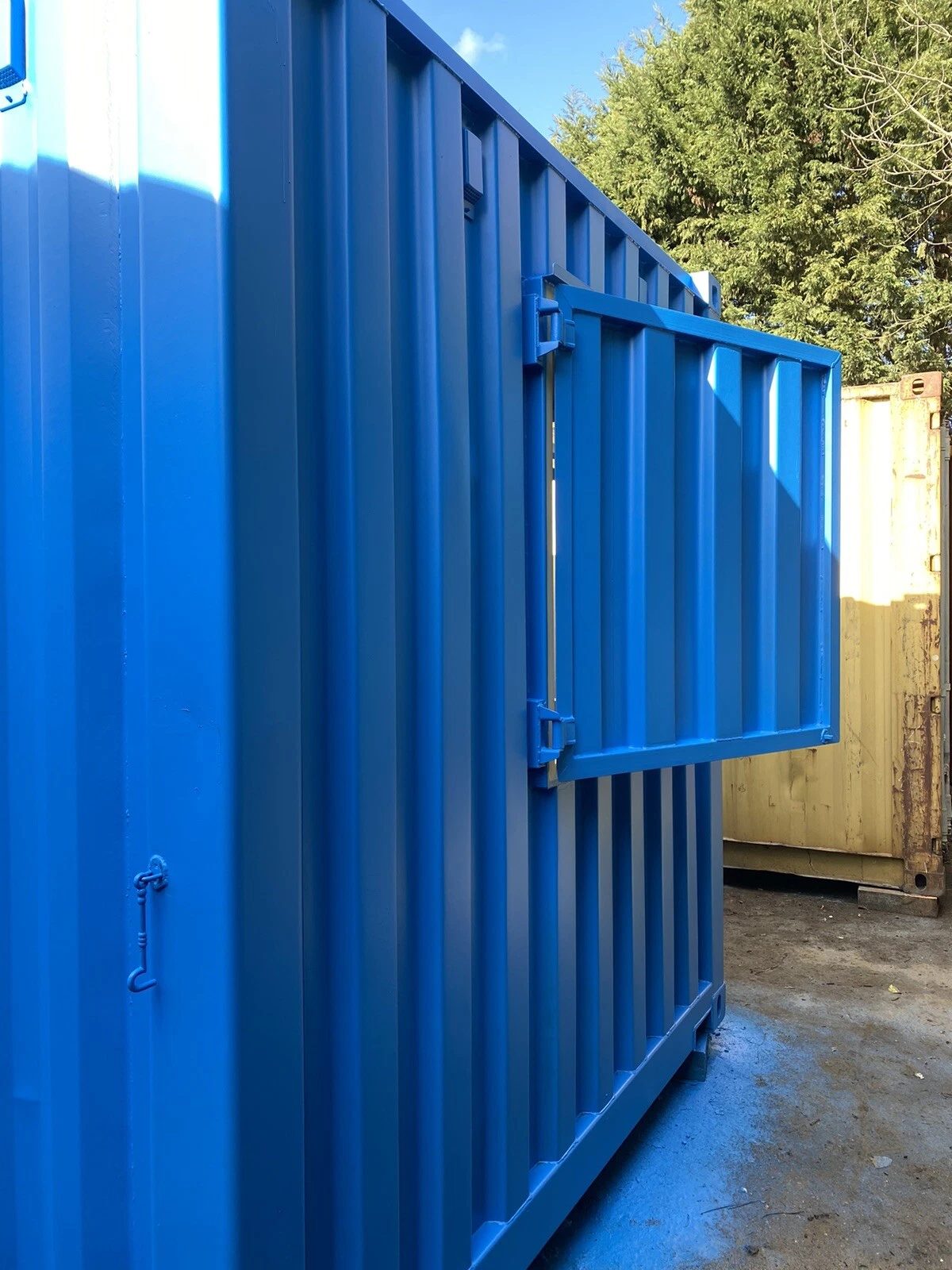 15ft Custom Container Bar & Kiosk – Side Service Hatches – blue container side with outward opening steel service shutter