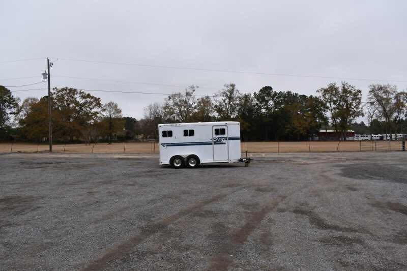 1995 Featherlite 2 Horse Trailer – Aluminum, Dressing Room – Wide distance shot of the horse trailer parked in a gravel lot
