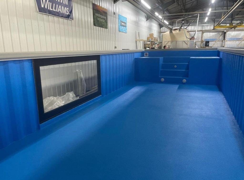 40ft Custom Container Pool – Side Viewing Window – empty blue container pool with steps and side window