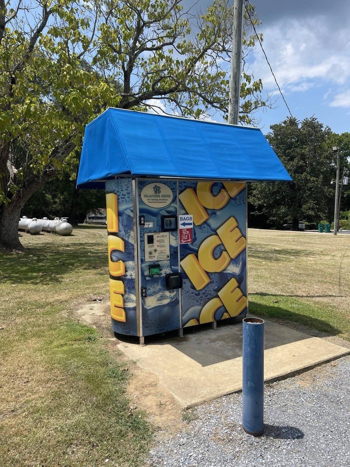 Commercial Ice Vending Machine – Bagged and Bulk Dispensing – outdoor ice vending machine beneath a blue canopy