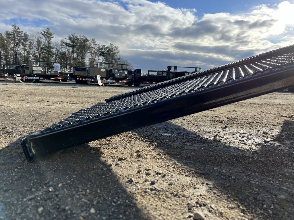 2024 Diamond C 22 ft Deckover Trailer – Slide-In Ramps – Low angle view of the end of a black mesh loading ramp