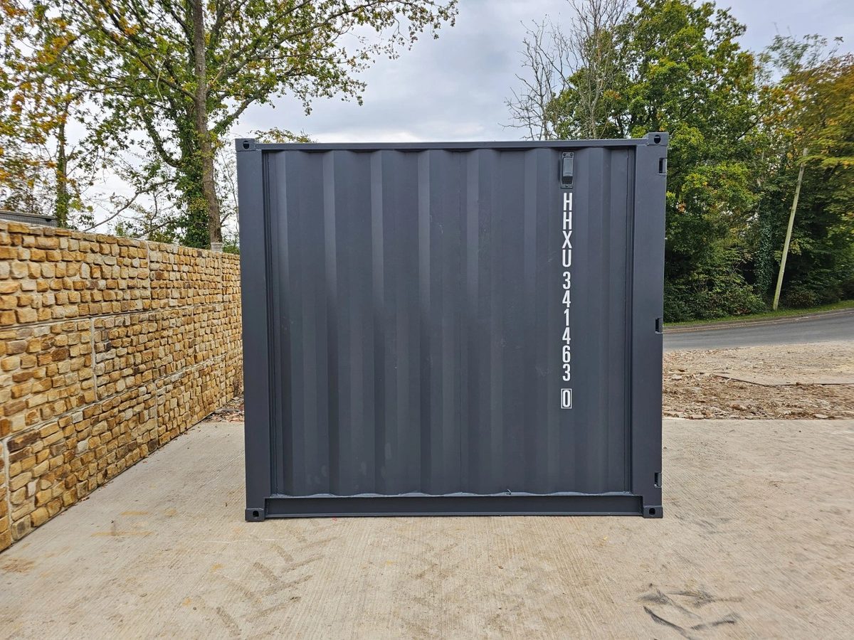 8ft New Shipping Container – Lockbox and Barred Windows – straight-on exterior view of container end wall