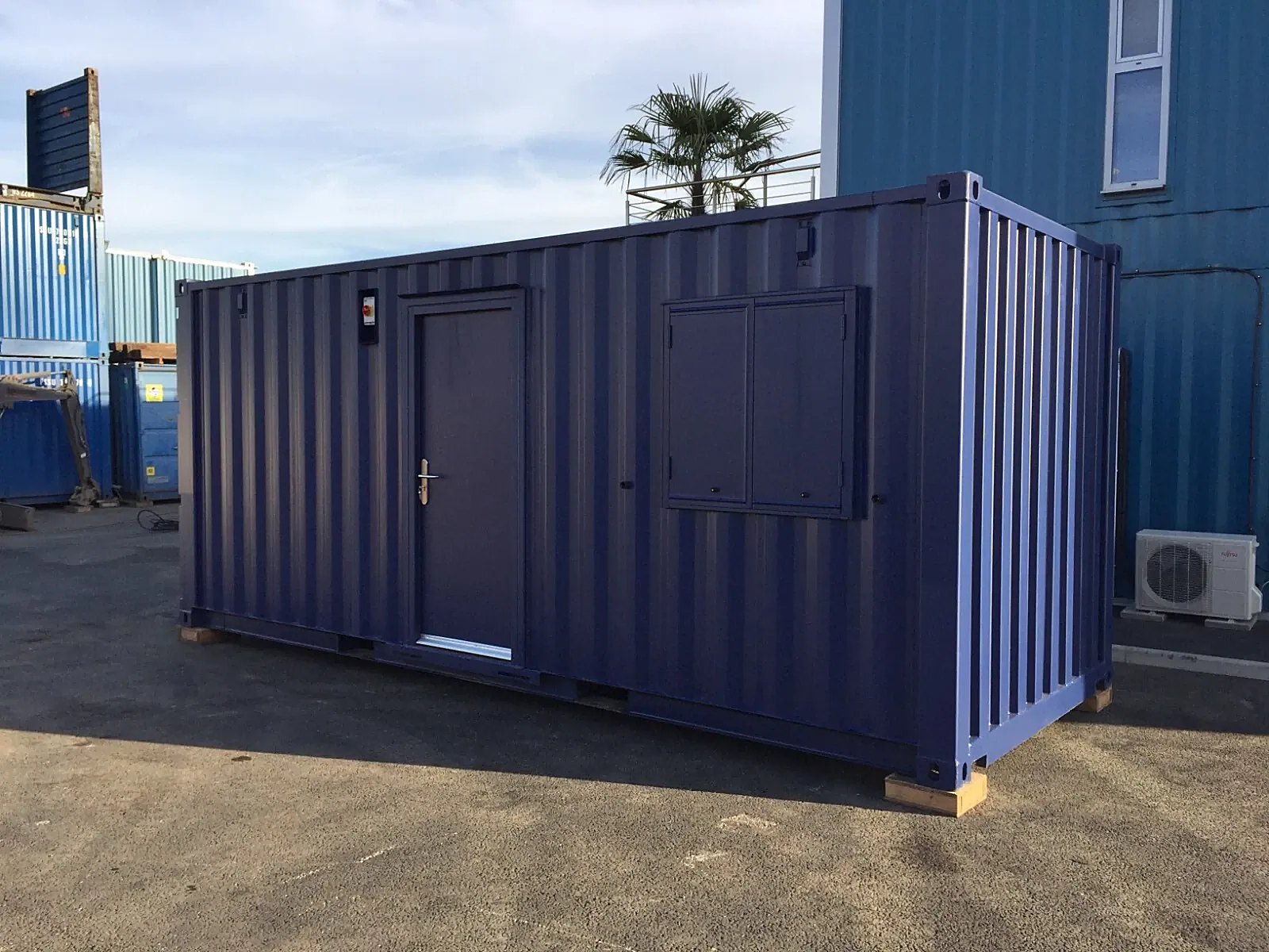 20ft Portable Office Cabin – Insulated Steel Workspace – three-quarter exterior of office cabin with door and closed shutters