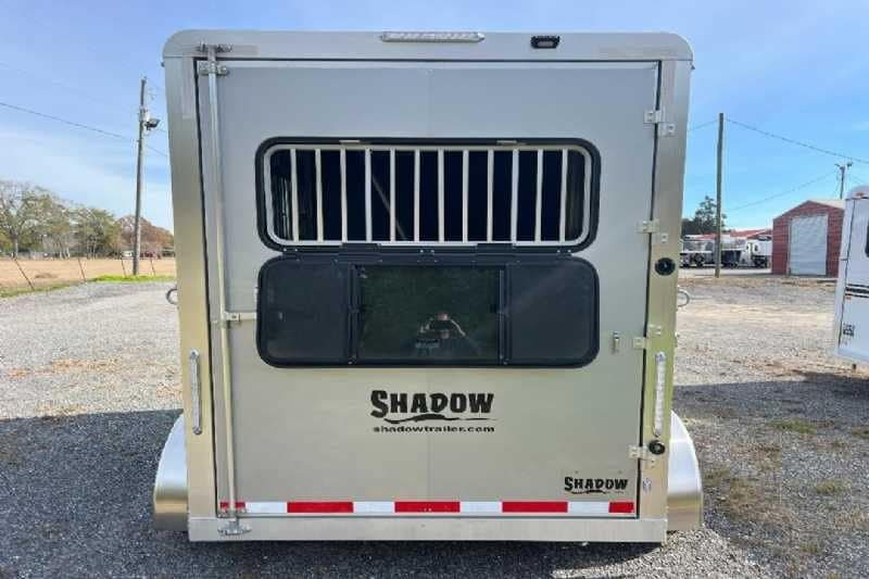 2024 Shadow 2 Horse Bumper Pull Trailer – Aluminum, Dressing Room – Direct rear view of the trailer with horse area window and bars