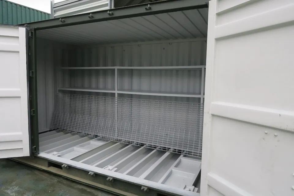 20ft Bunded Storage Container – Integrated Spill Containment – open storage container with shelving and lifted floor grating