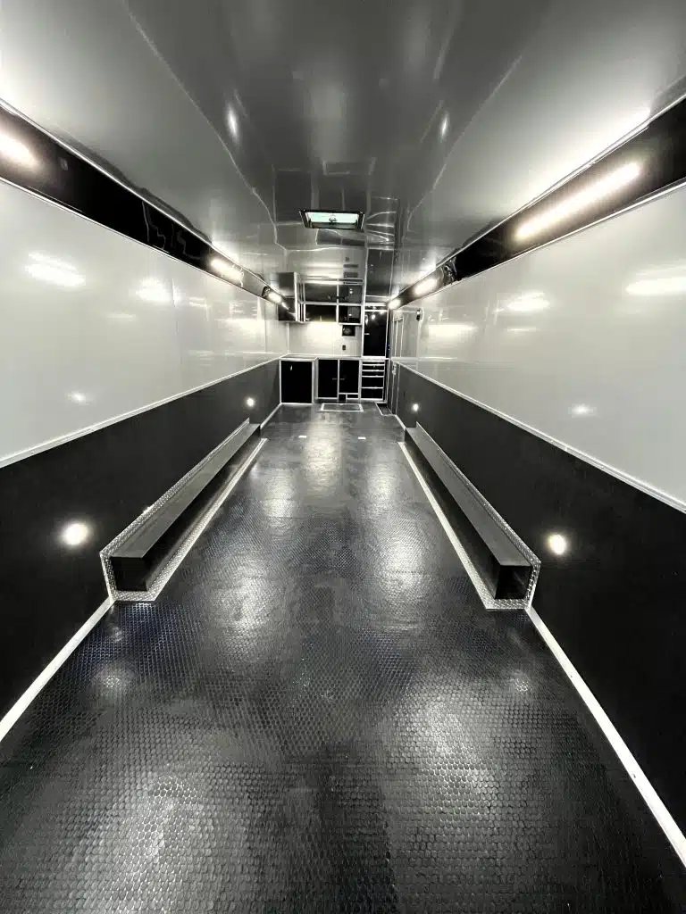 2025 Haulmark Edge 34 ft Race Trailer – Turbo Package – Internal view of the trailer looking forward towards the front cabinets and lighting