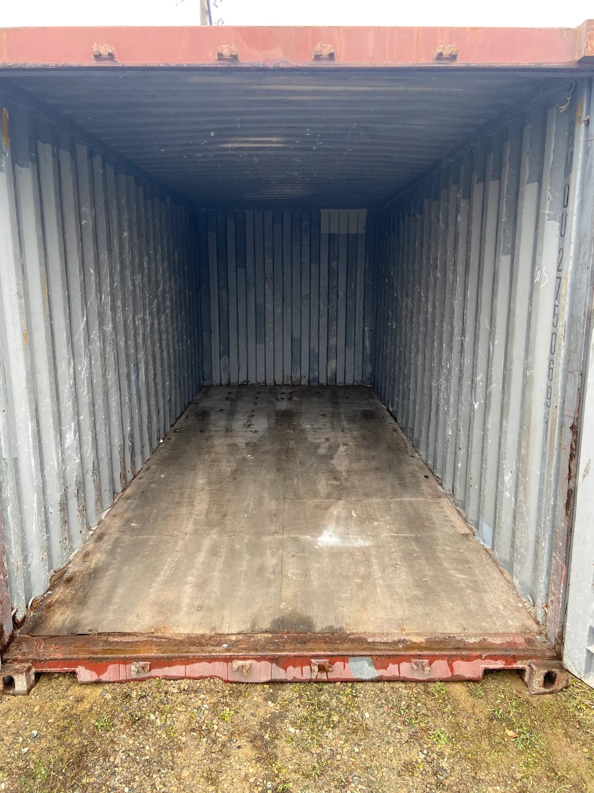 20ft Used Shipping Container – Double Cargo Doors – empty container interior with worn wooden floor and corrugated walls